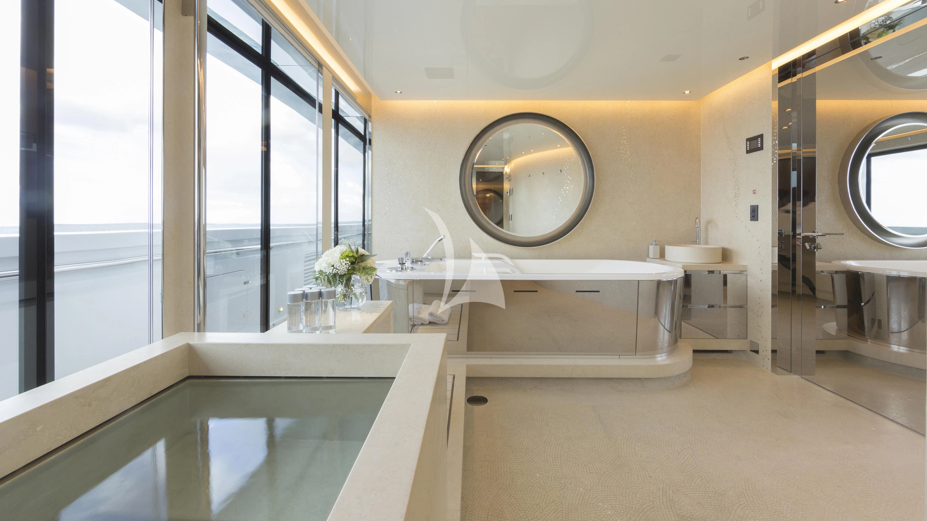 a bathroom with a large round mirror aboard NAUTILUS Yacht for Sale