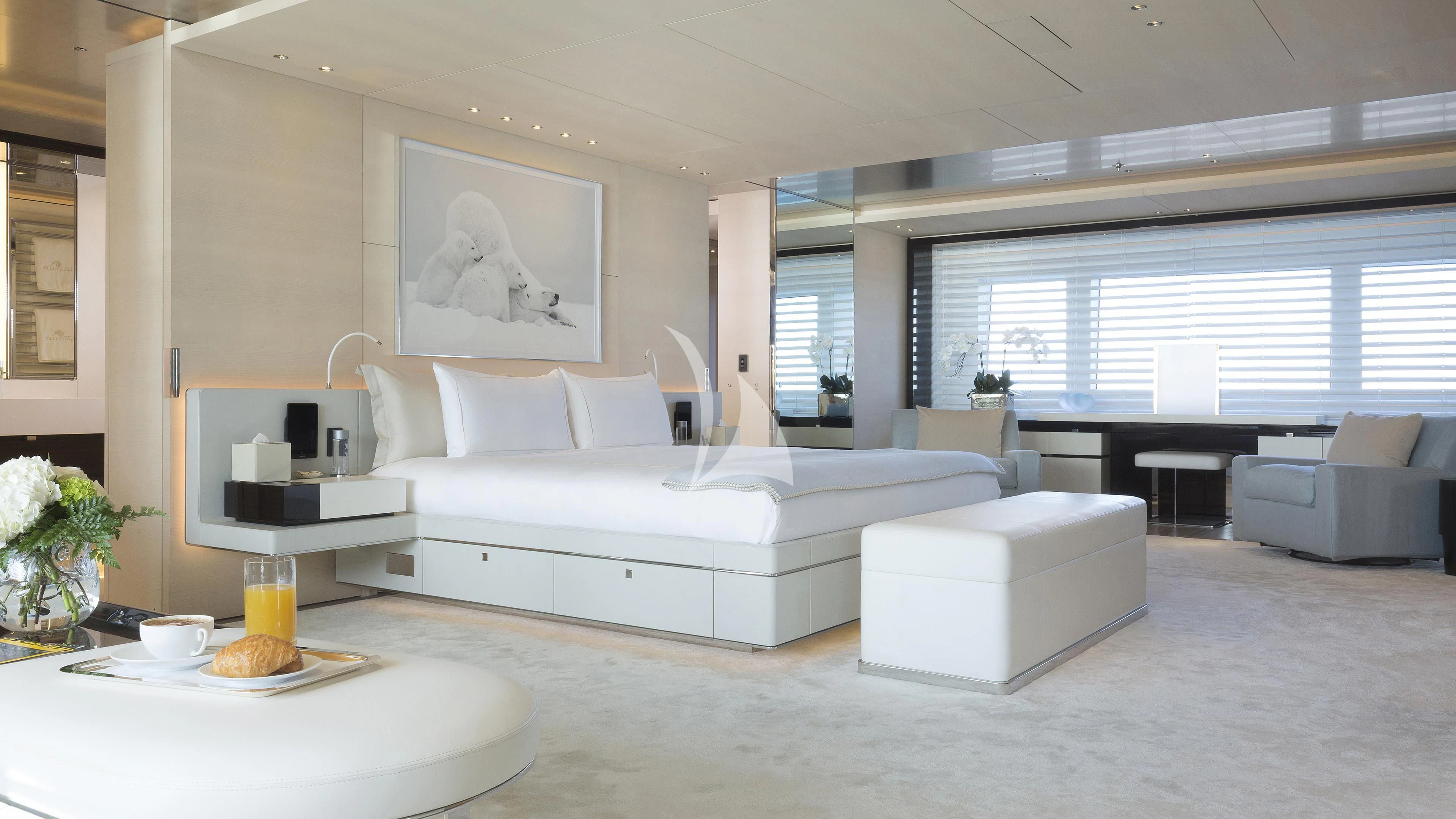 a living room with a white couch and a white coffee table aboard NAUTILUS Yacht for Sale