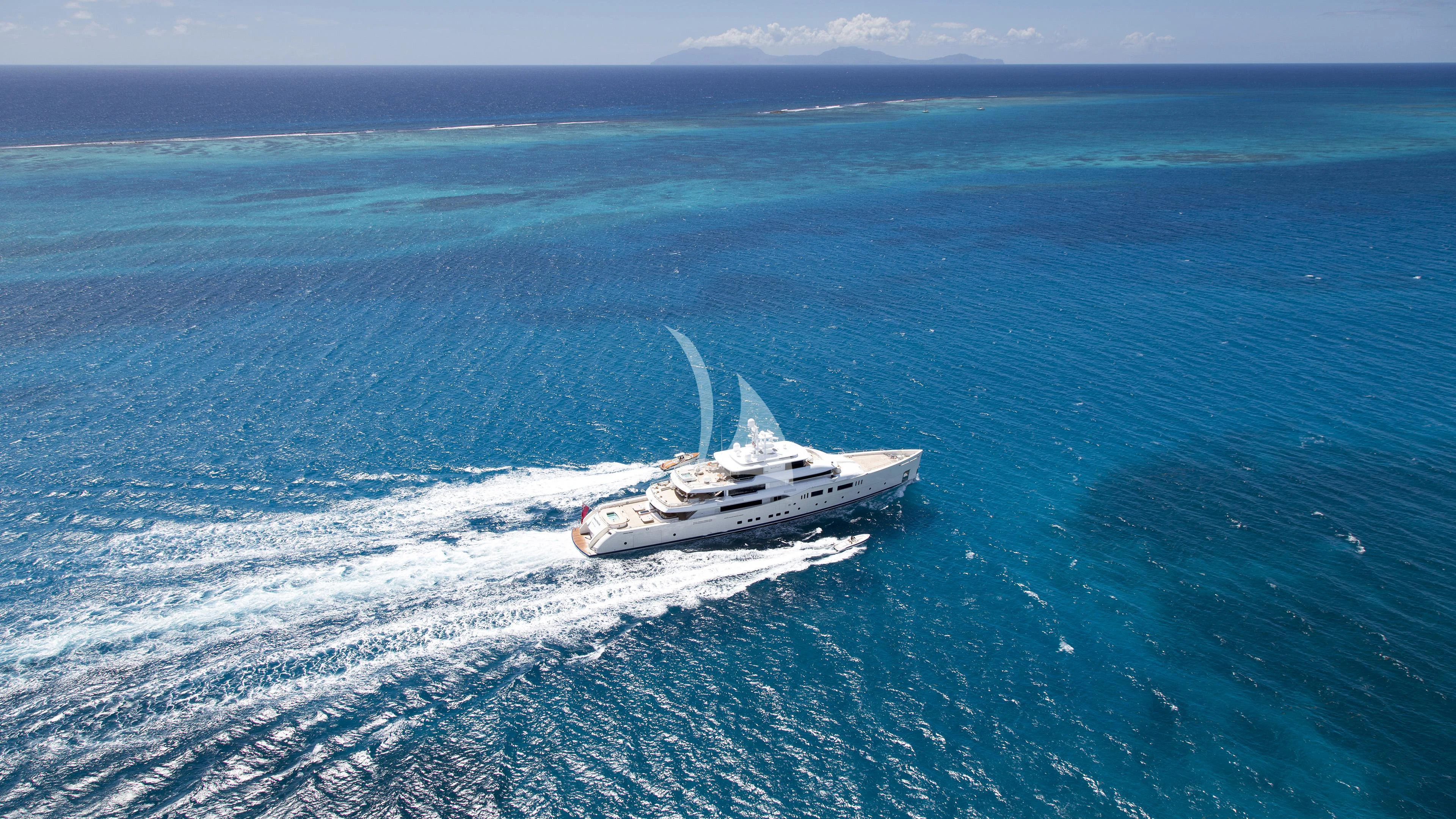 a white boat in the water aboard NAUTILUS Yacht for Sale