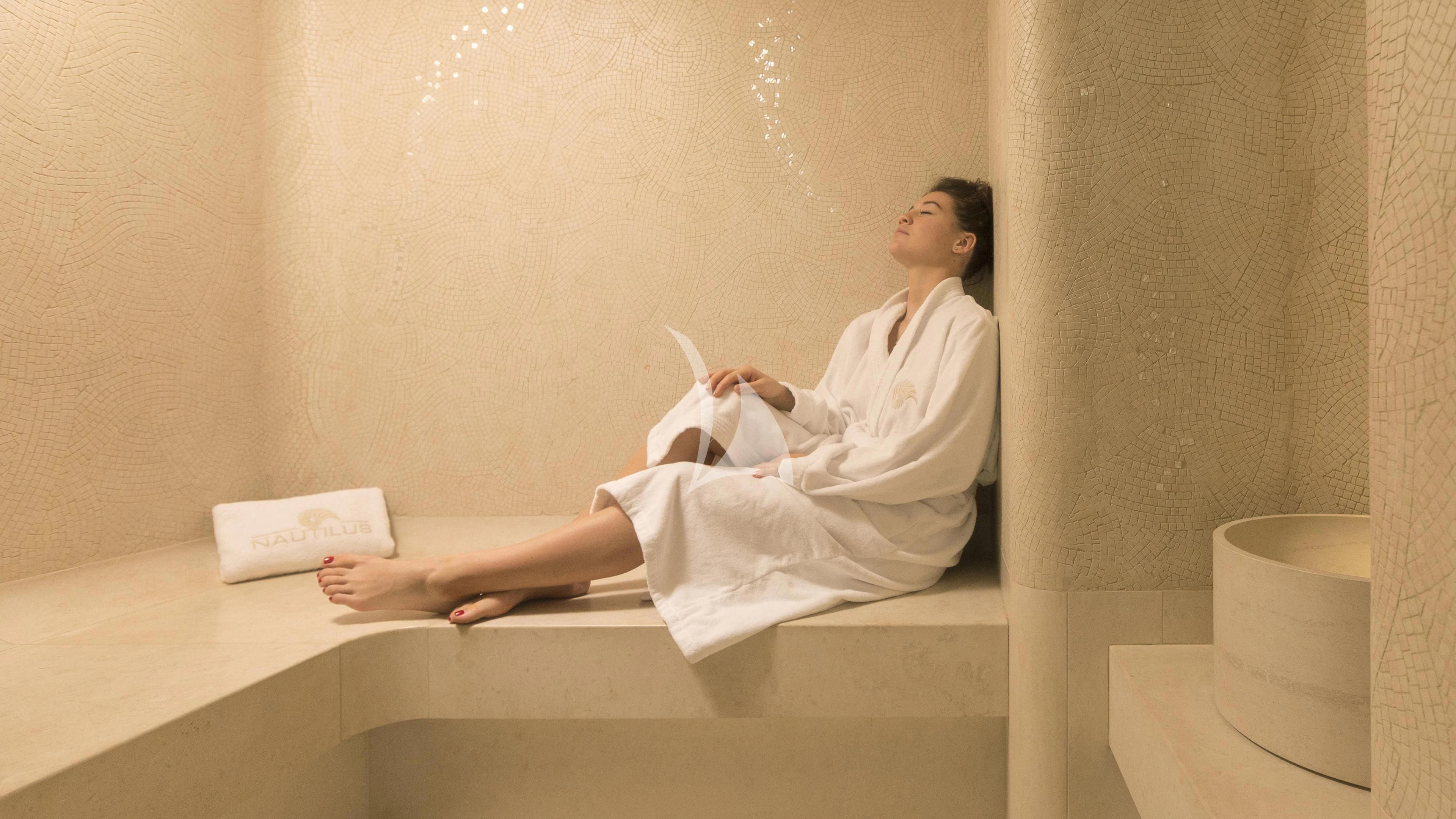 a person sitting on a bench aboard NAUTILUS Yacht for Sale