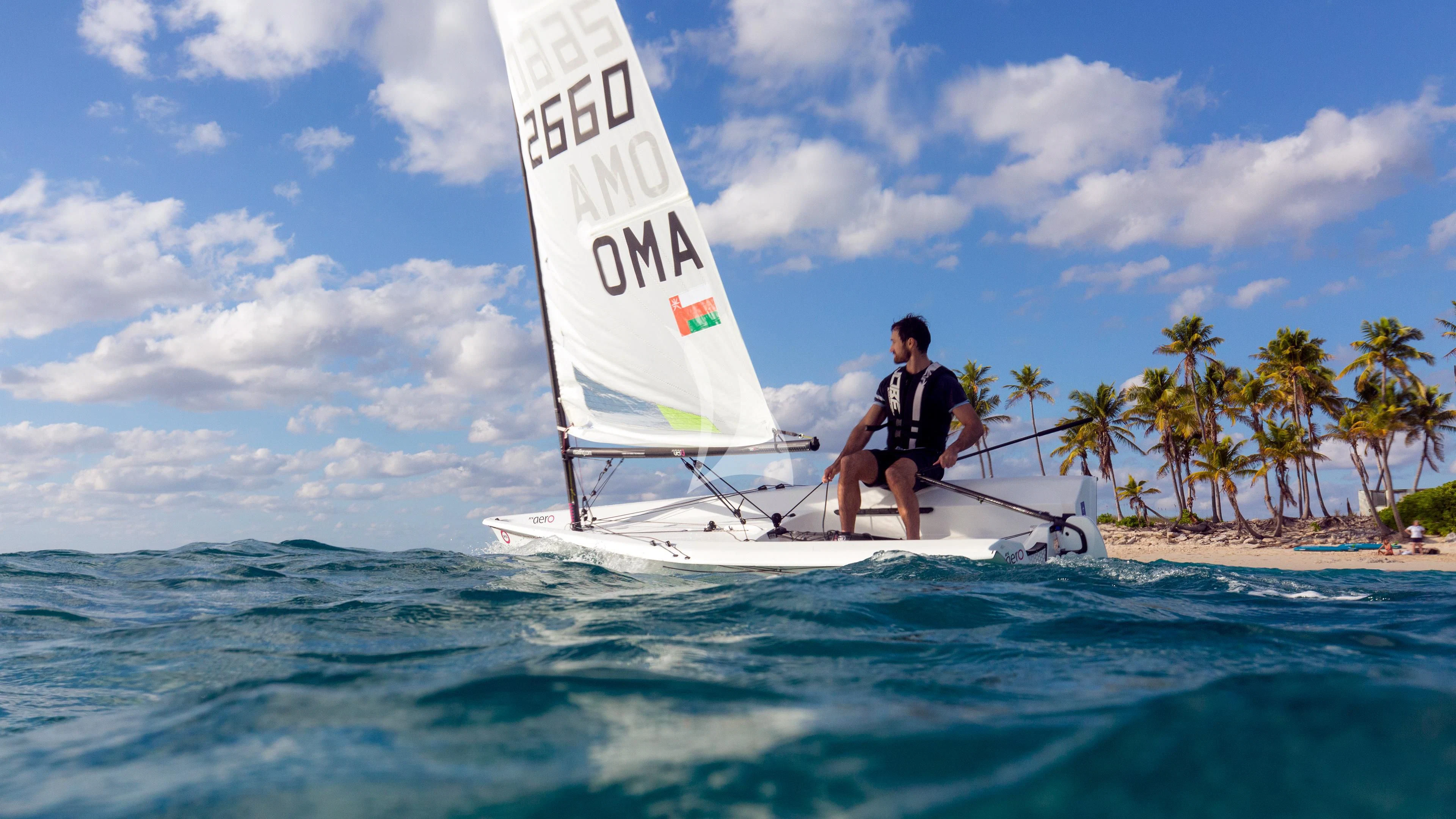 a man sailing on a white sailboat on the water aboard NAUTILUS Yacht for Sale