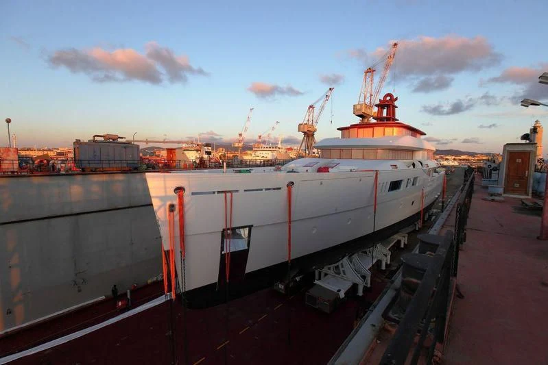a large white ship in a harbor aboard NAUTILUS Yacht for Sale