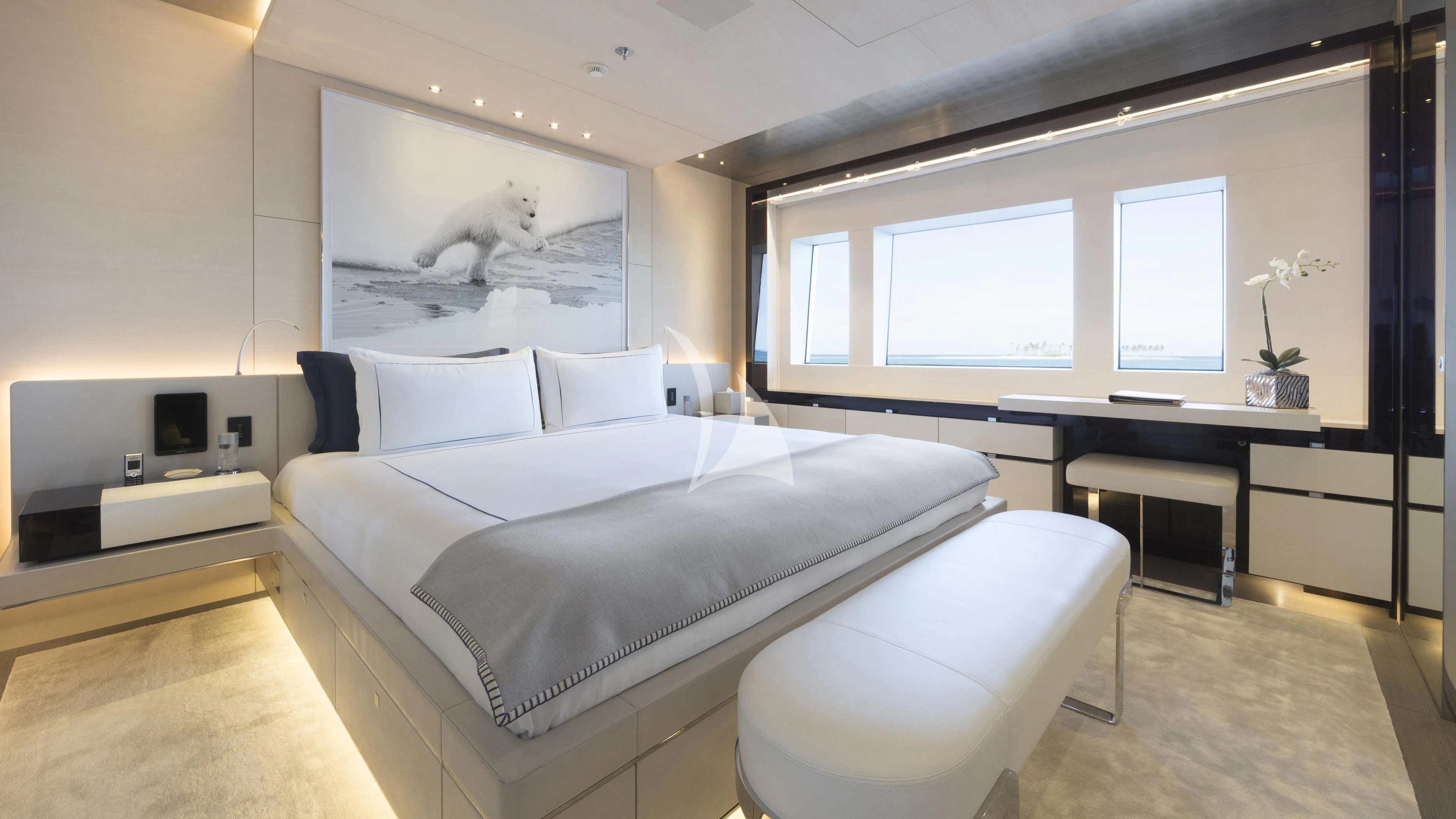 a room with a bed and desk aboard NAUTILUS Yacht for Sale