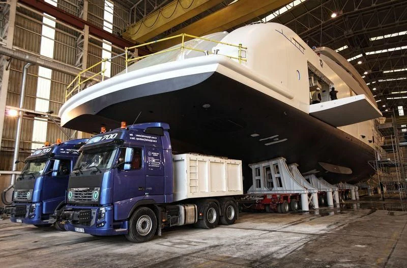 a large white boat on top of a truck aboard NAUTILUS Yacht for Sale