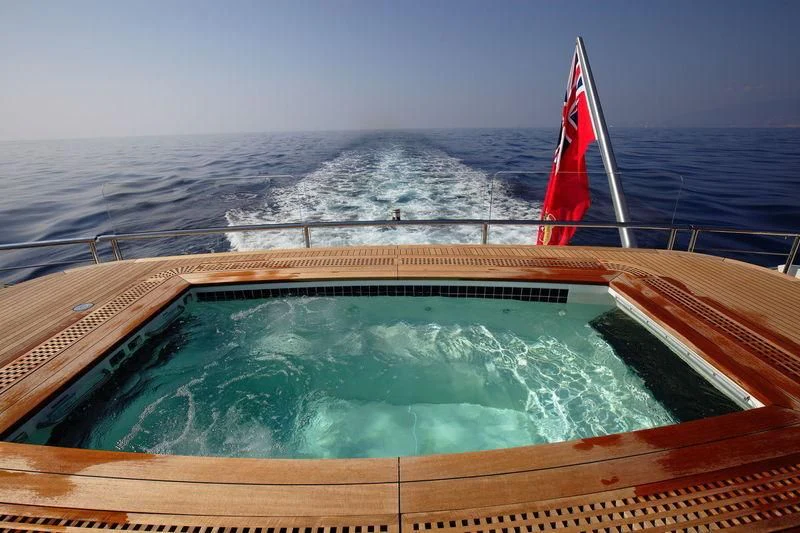 a boat with a flag on it aboard NAUTILUS Yacht for Sale