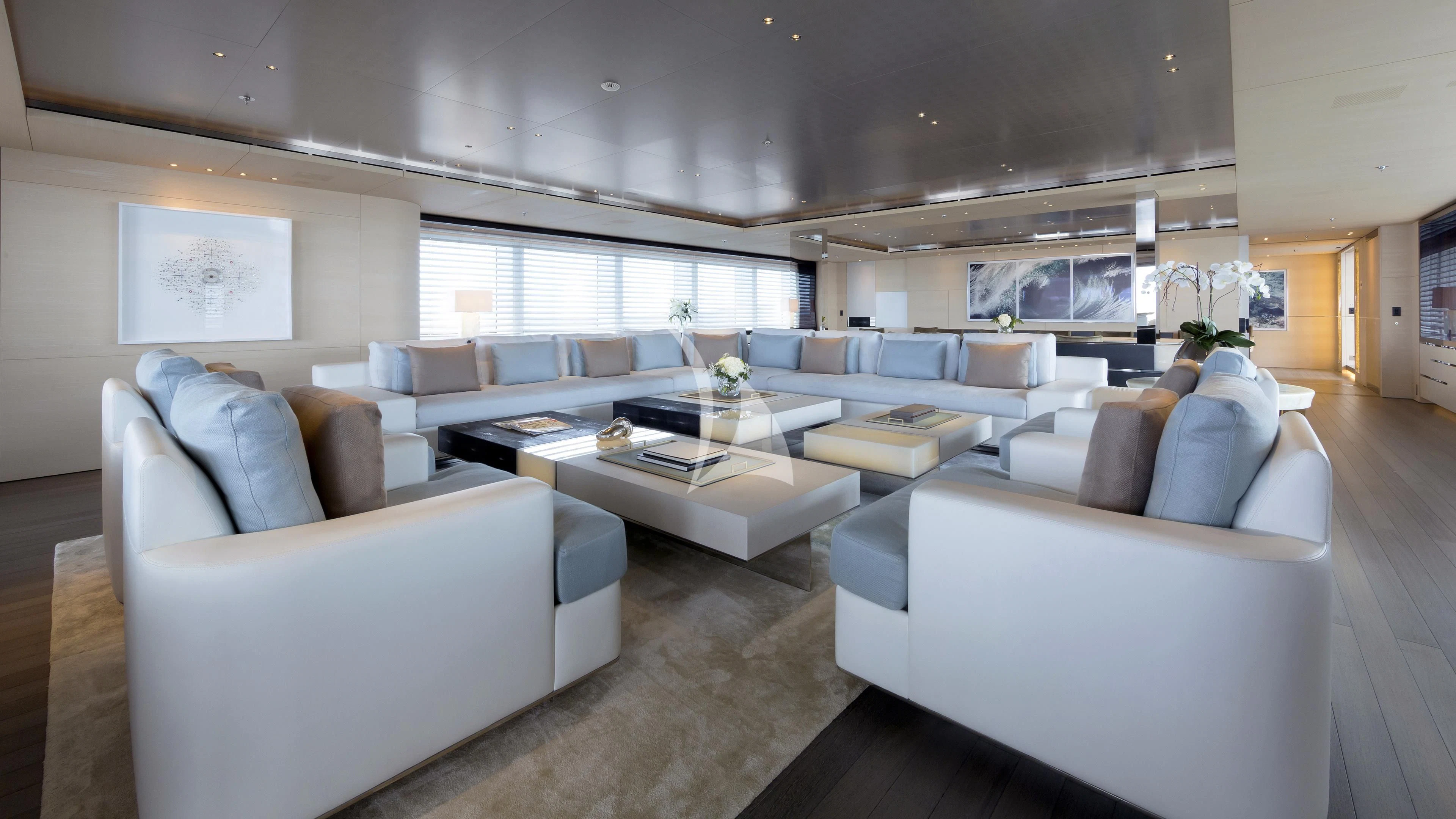 a living room with white couches aboard NAUTILUS Yacht for Sale
