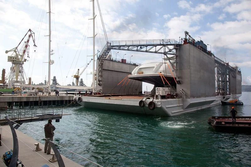 a large ship docked at a pier aboard NAUTILUS Yacht for Sale