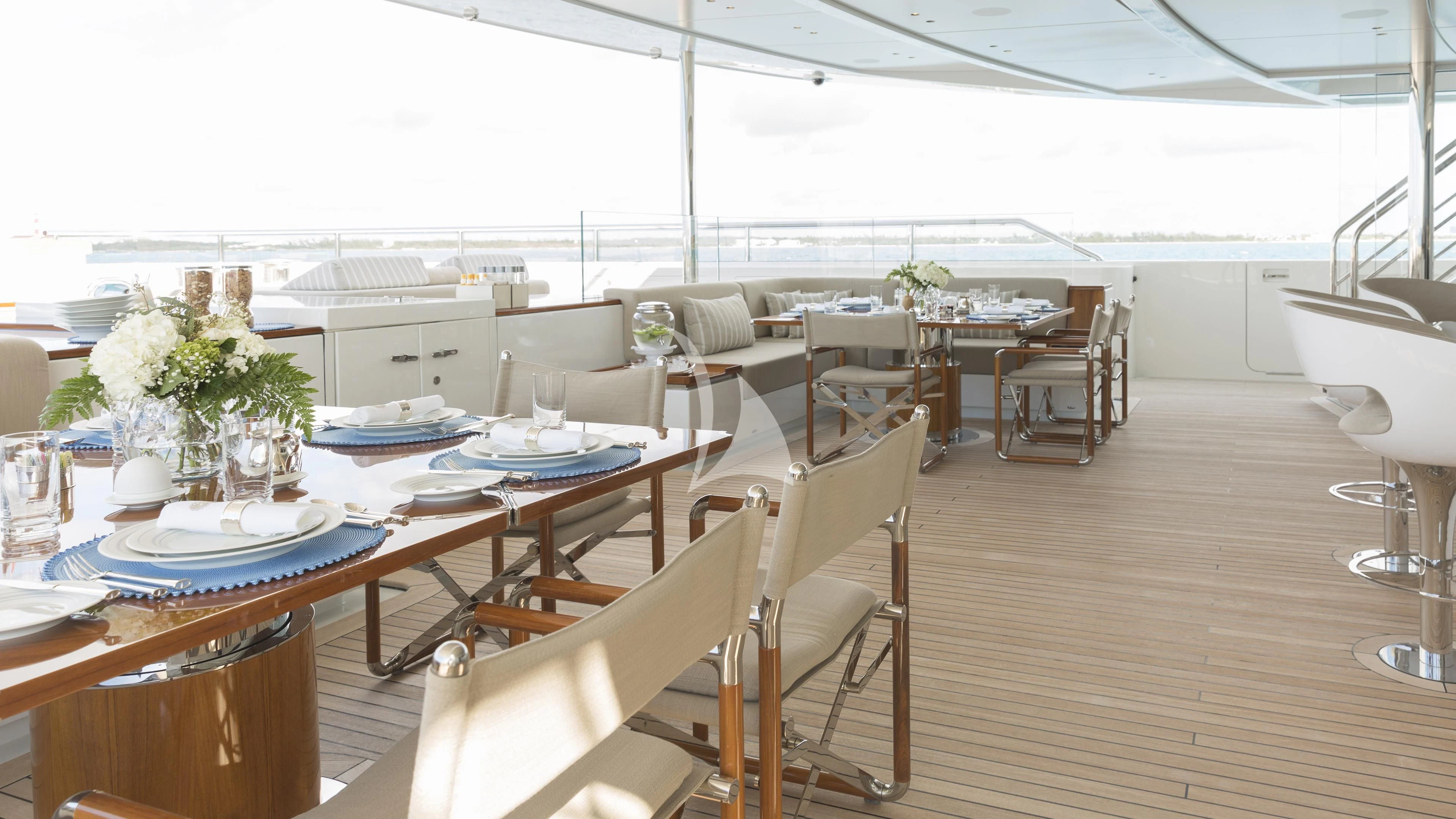 a room with tables and chairs aboard NAUTILUS Yacht for Sale