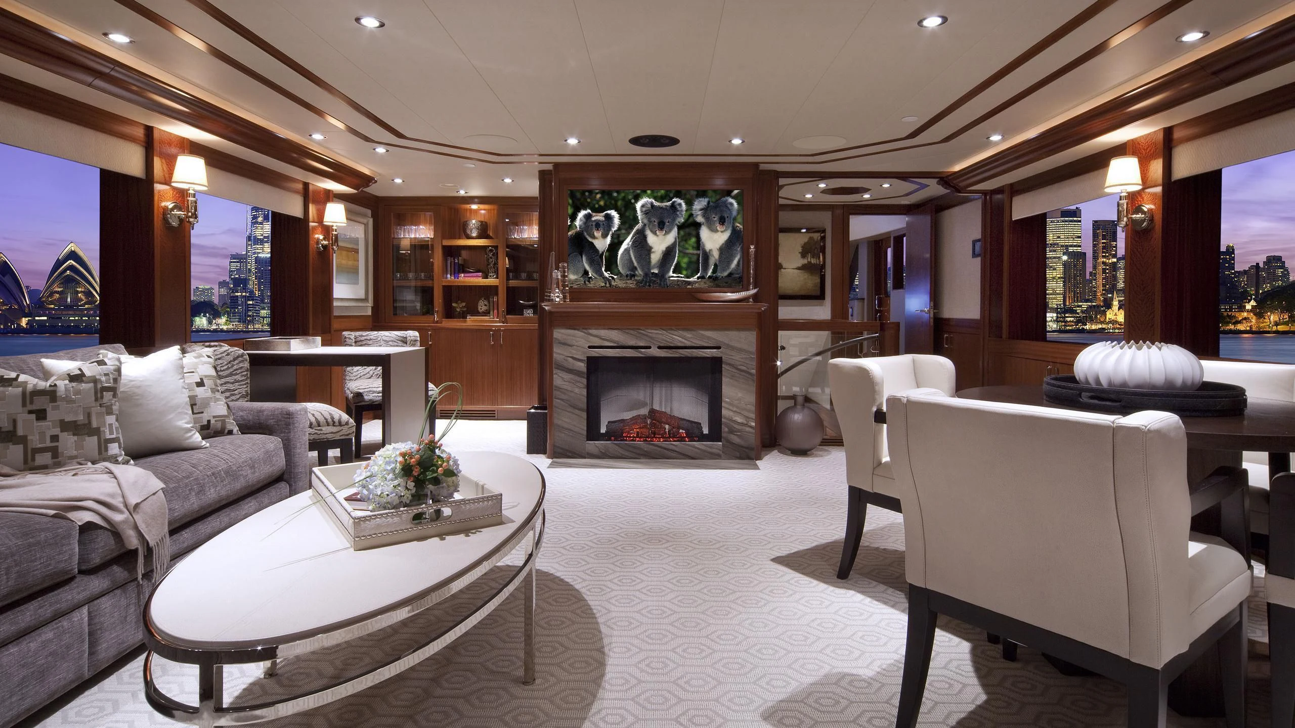 a living room with a fireplace aboard WESTPORT 130 #4016 Yacht for Sale