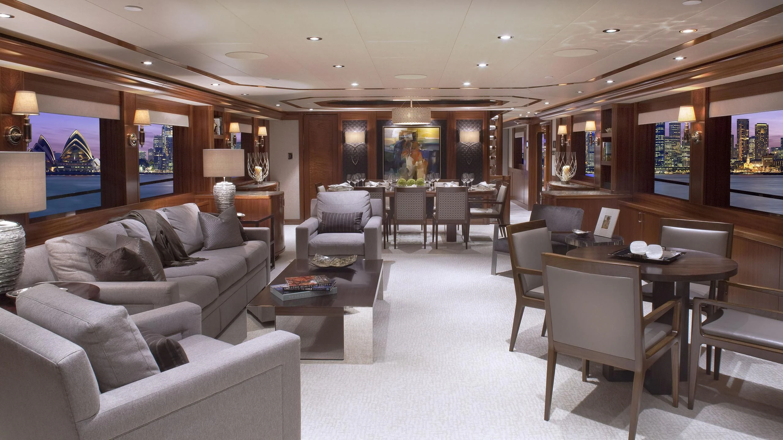 a living room with a couch and a table aboard WESTPORT 130 #4016 Yacht for Sale