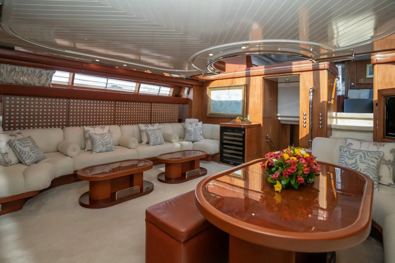 a living room with a table and couches aboard LA CATTIVA 1 Yacht for Sale