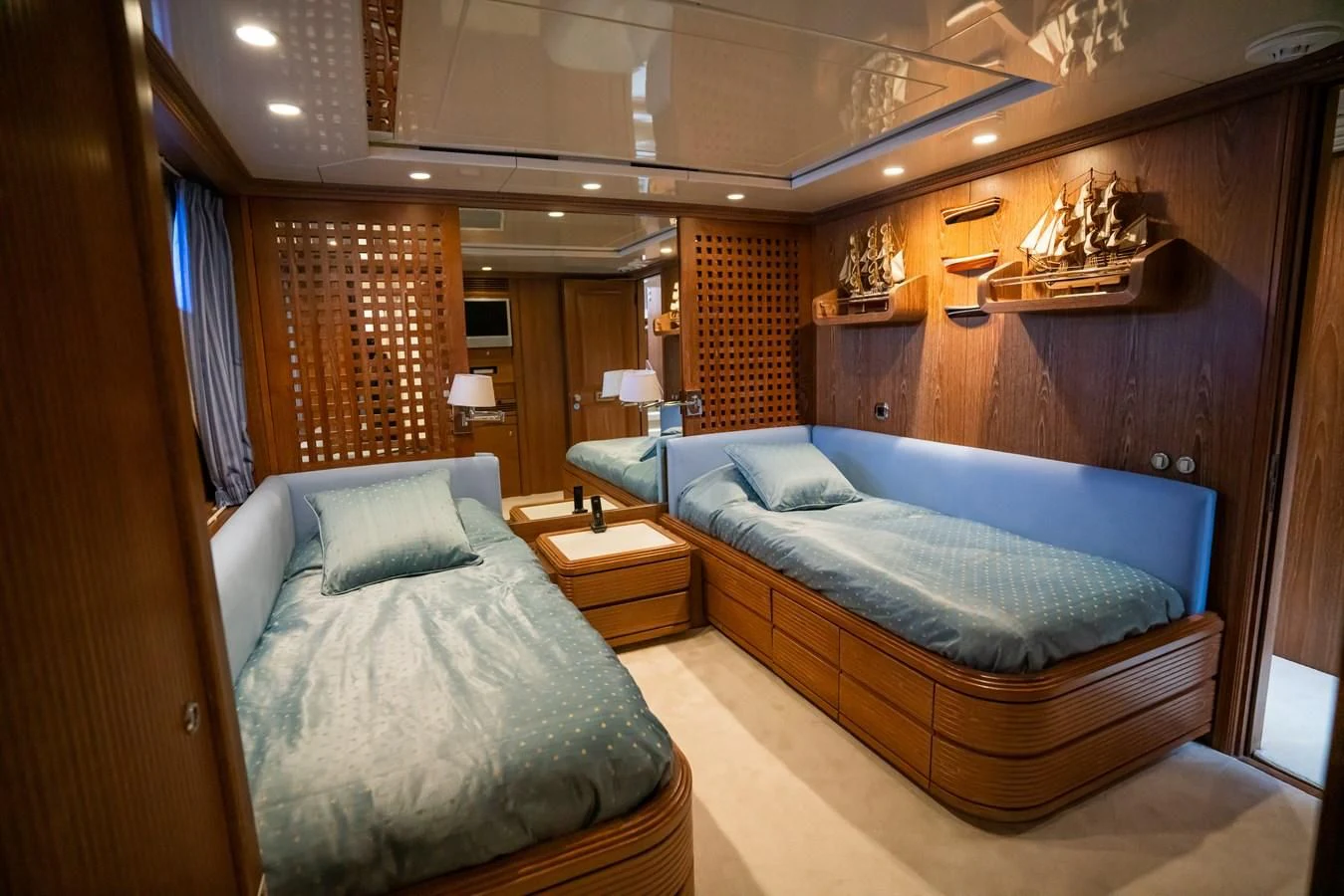 a room with a bed and a desk aboard LA CATTIVA 1 Yacht for Sale