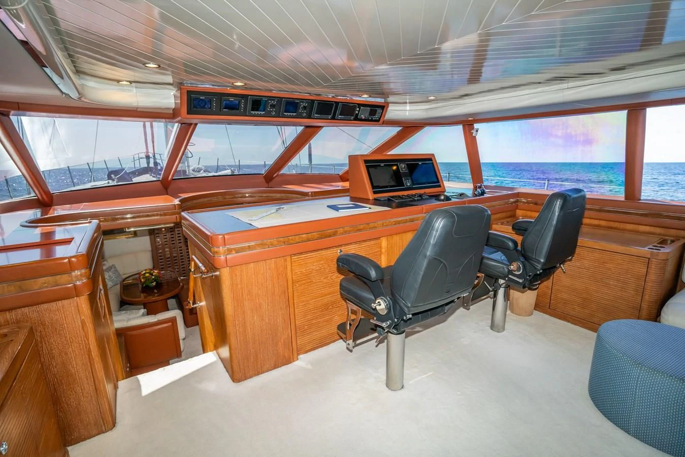 a room with a desk and chairs aboard LA CATTIVA 1 Yacht for Sale