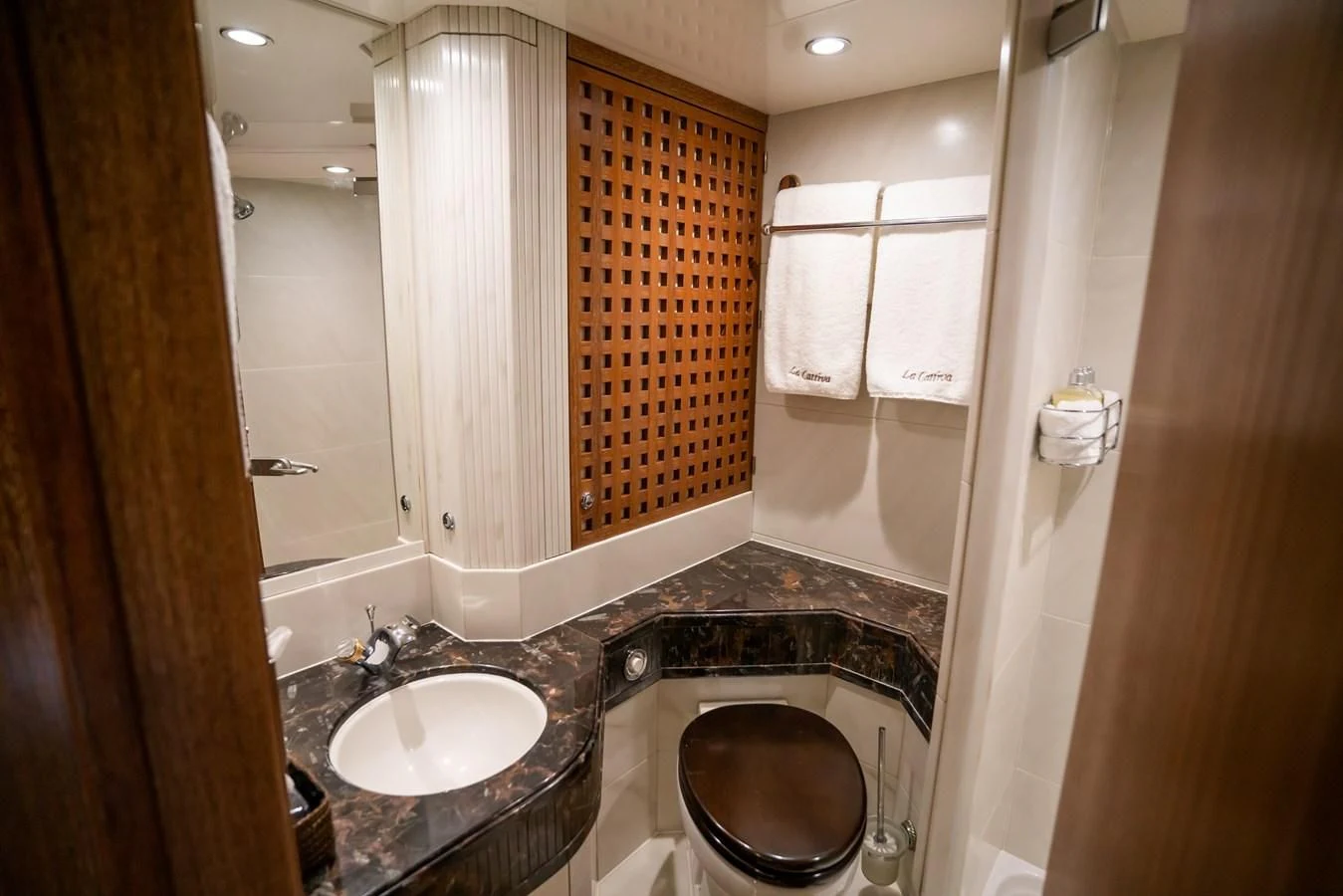 a bathroom with a sink and a tub aboard LA CATTIVA 1 Yacht for Sale