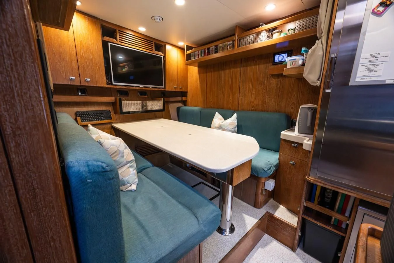 a room with a bed and a desk aboard LA CATTIVA 1 Yacht for Sale