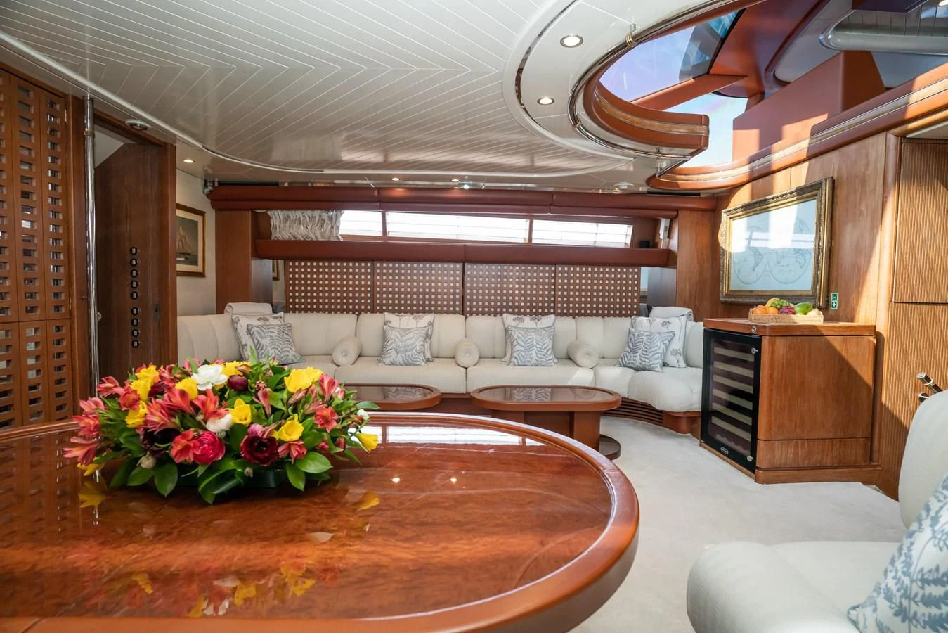 a living room with a large table aboard LA CATTIVA 1 Yacht for Sale