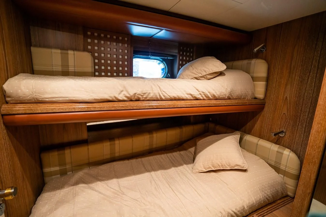 a bed with white sheets aboard LA CATTIVA 1 Yacht for Sale