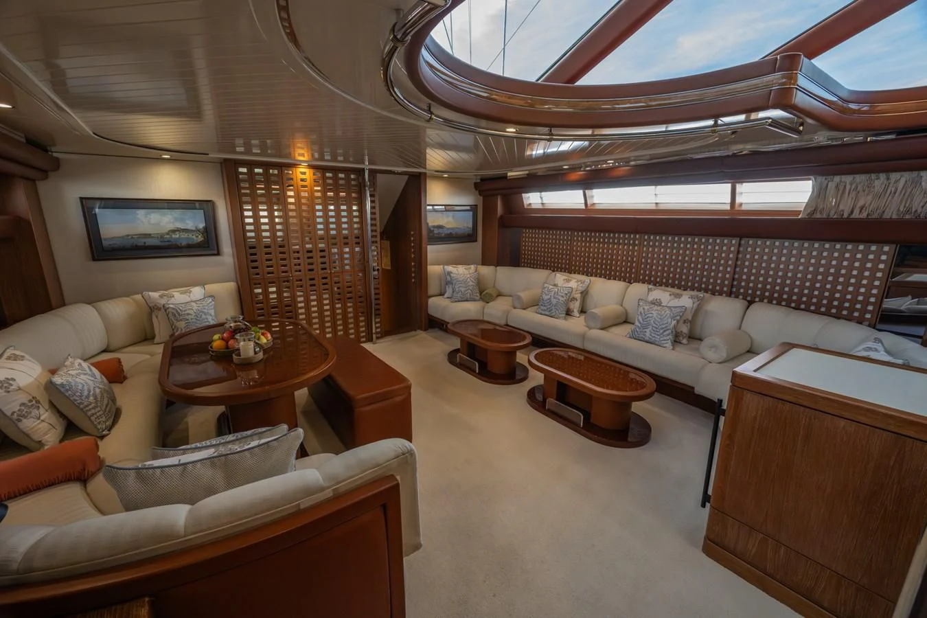 a large living room with a large bed and a table aboard LA CATTIVA 1 Yacht for Sale