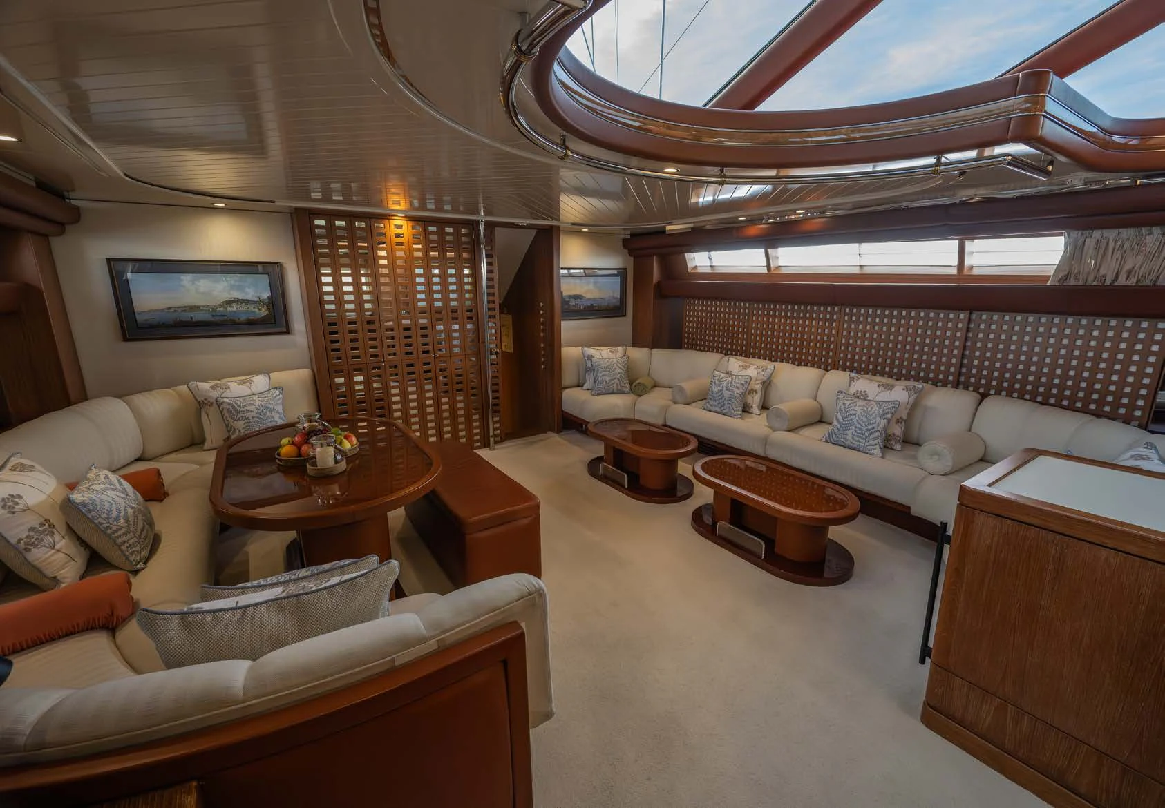 a large living room with a large bed and a table aboard LA CATTIVA 1 Yacht for Sale