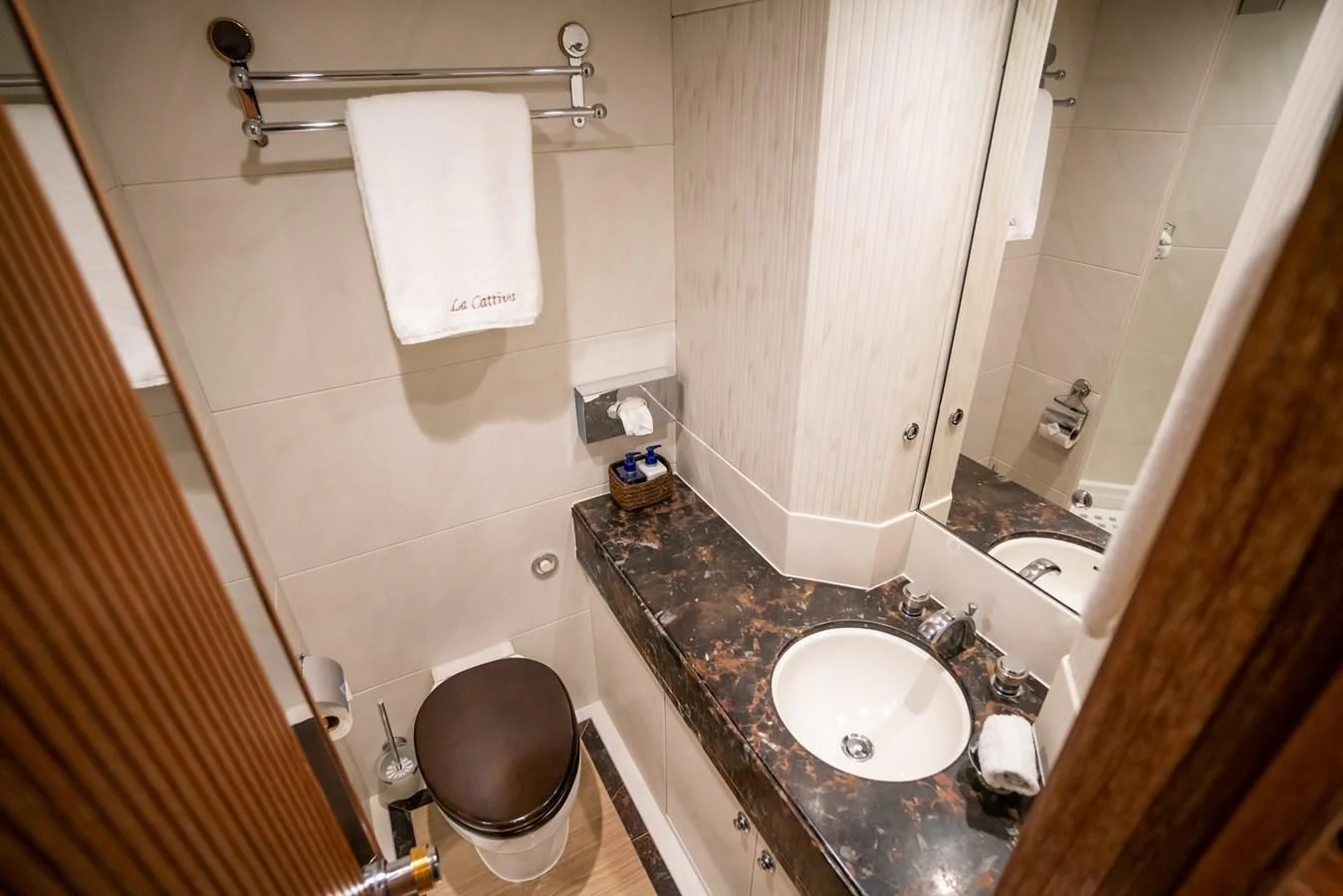 a bathroom with a sink and a mirror aboard LA CATTIVA 1 Yacht for Sale