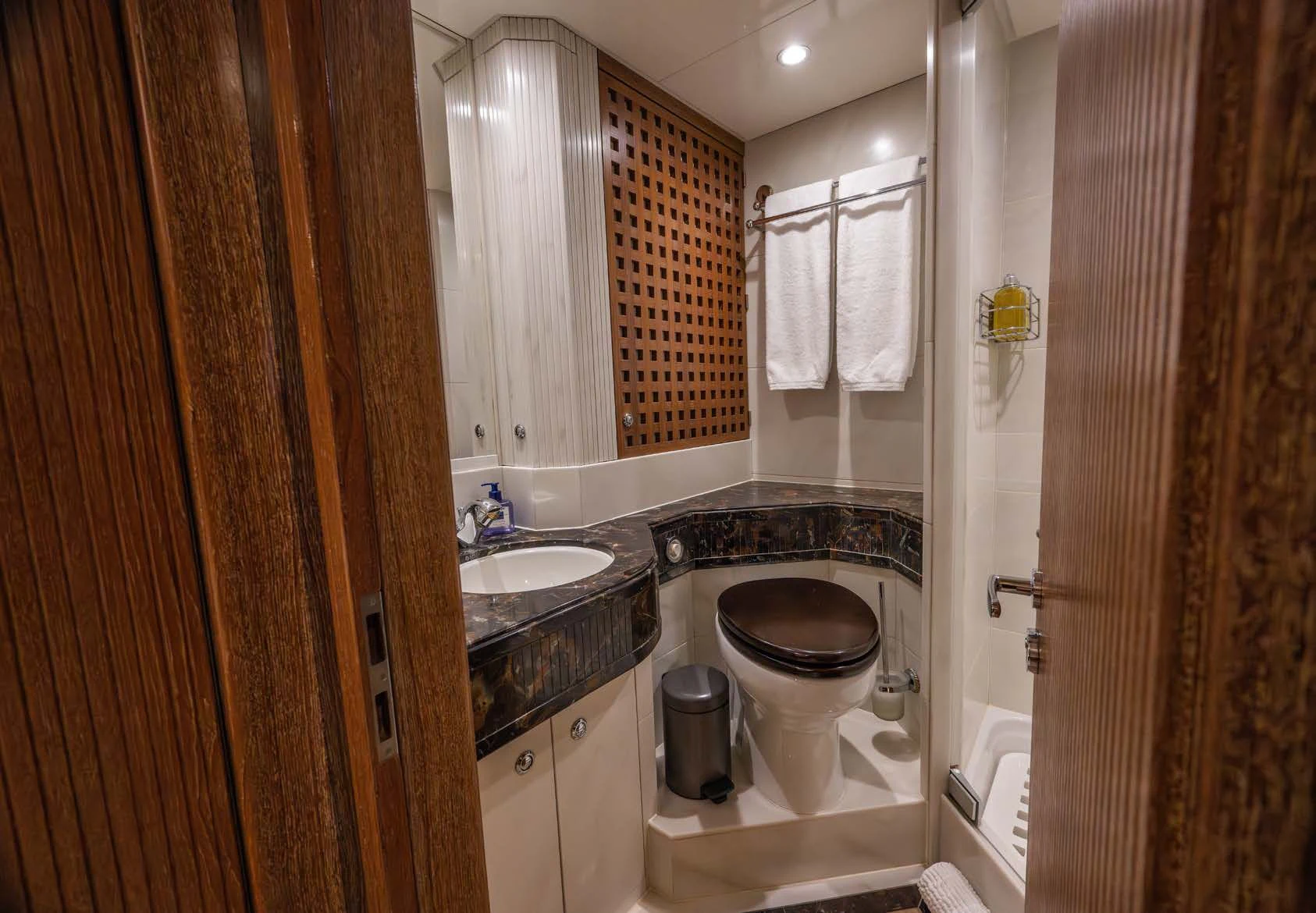 a bathroom with a toilet and a sink aboard LA CATTIVA 1 Yacht for Sale