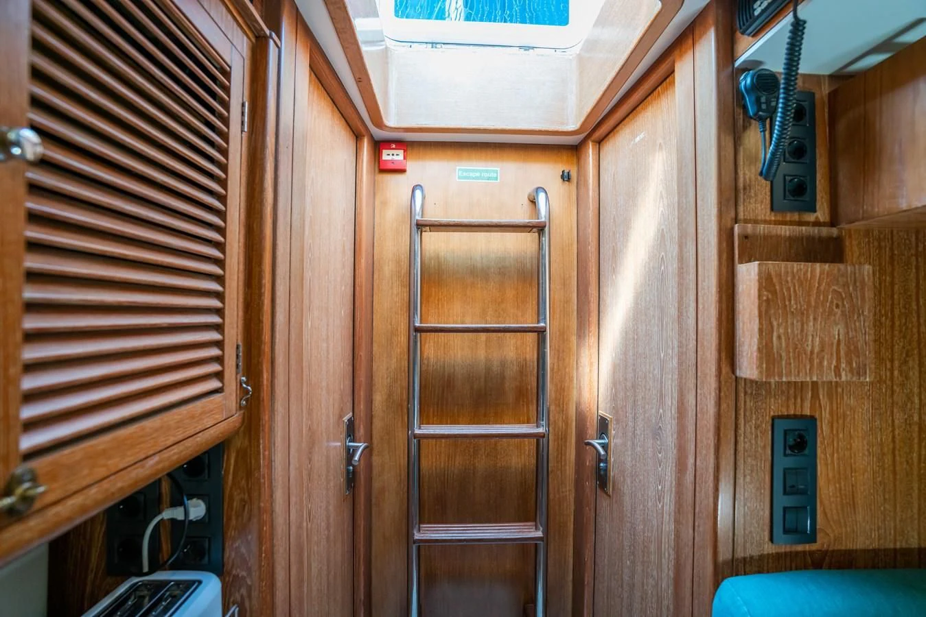 a room with wooden cabinets aboard LA CATTIVA 1 Yacht for Sale