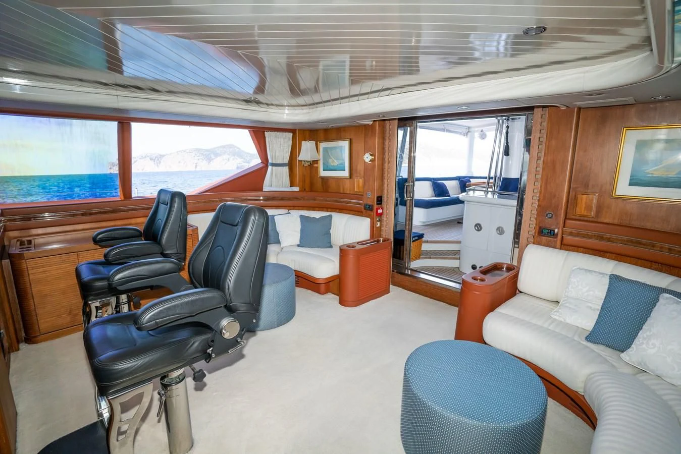 a room with a couch and a table and chairs aboard LA CATTIVA 1 Yacht for Sale