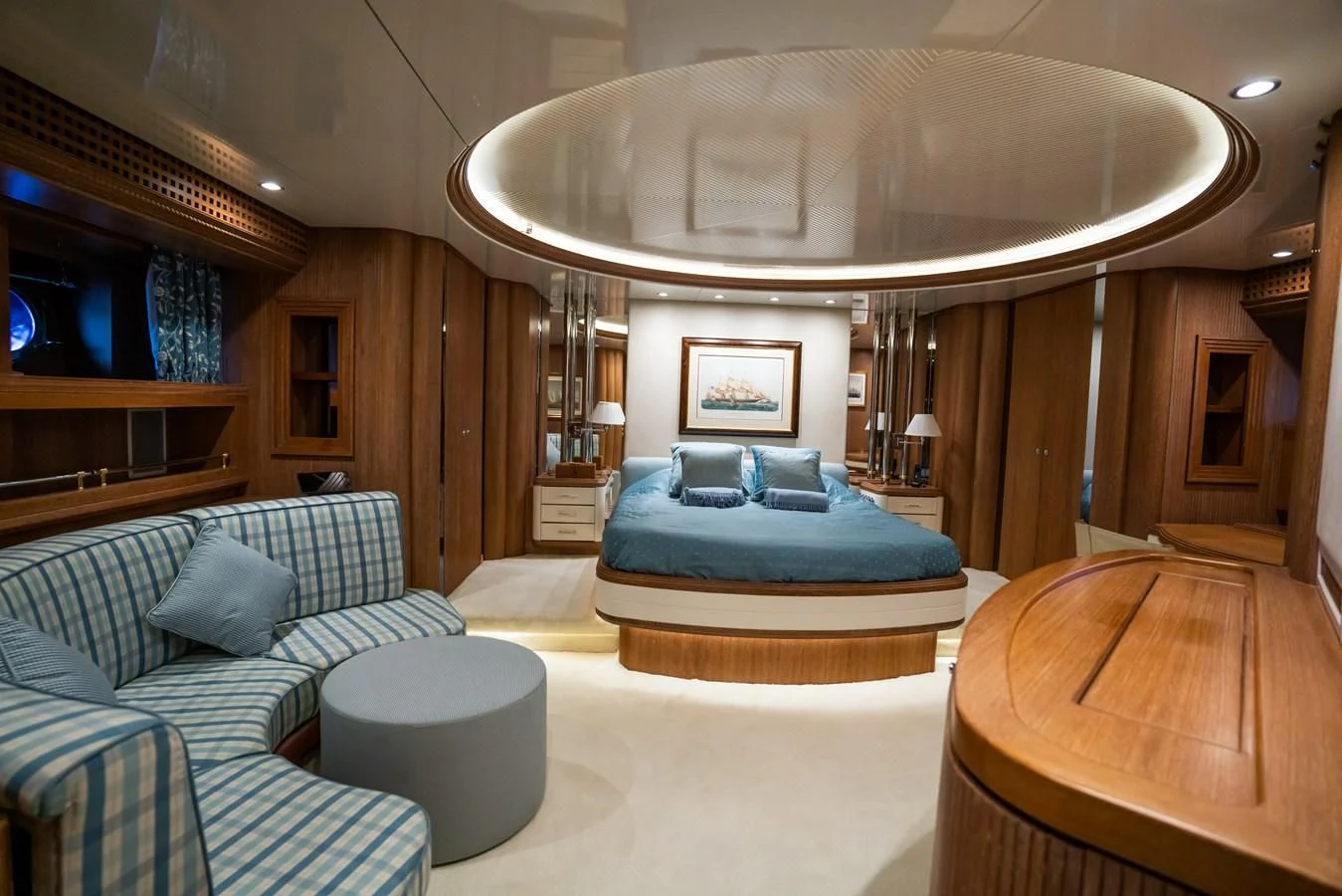 a large living room with a large mirror aboard LA CATTIVA 1 Yacht for Sale
