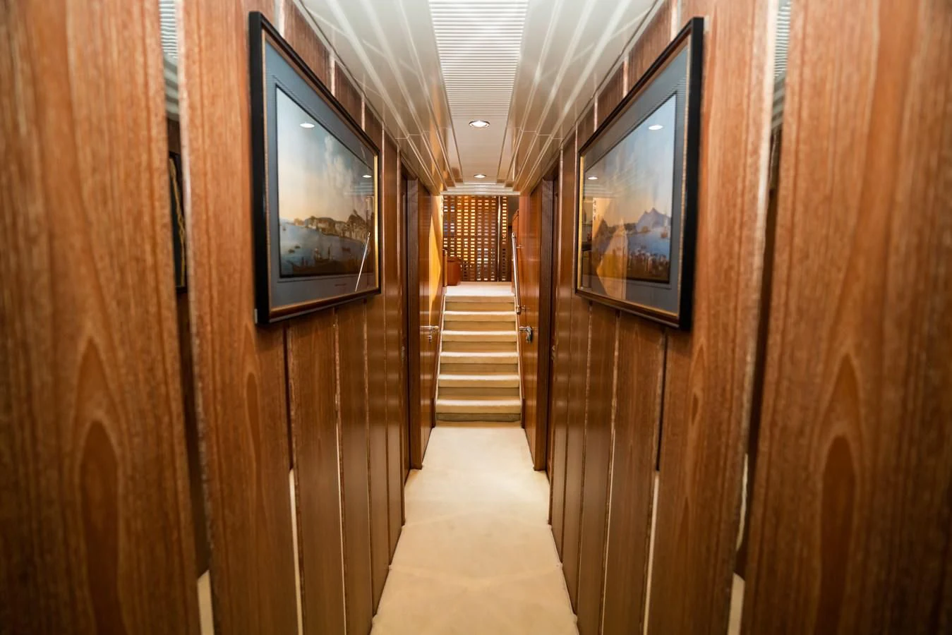 a wooden hallway with a television on the wall aboard LA CATTIVA 1 Yacht for Sale