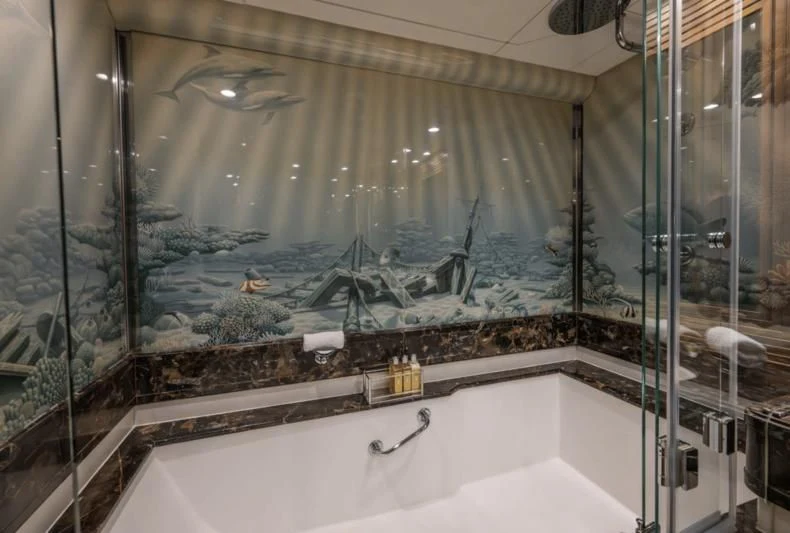 a bathroom with a large glass window aboard LA CATTIVA 1 Yacht for Sale