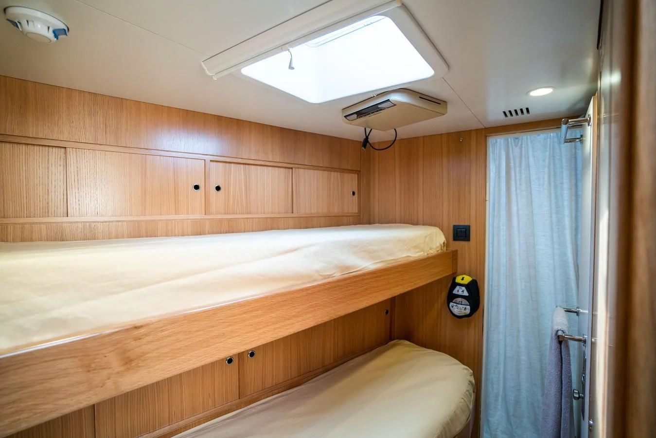 a room with a bed and a window aboard LA CATTIVA 1 Yacht for Sale