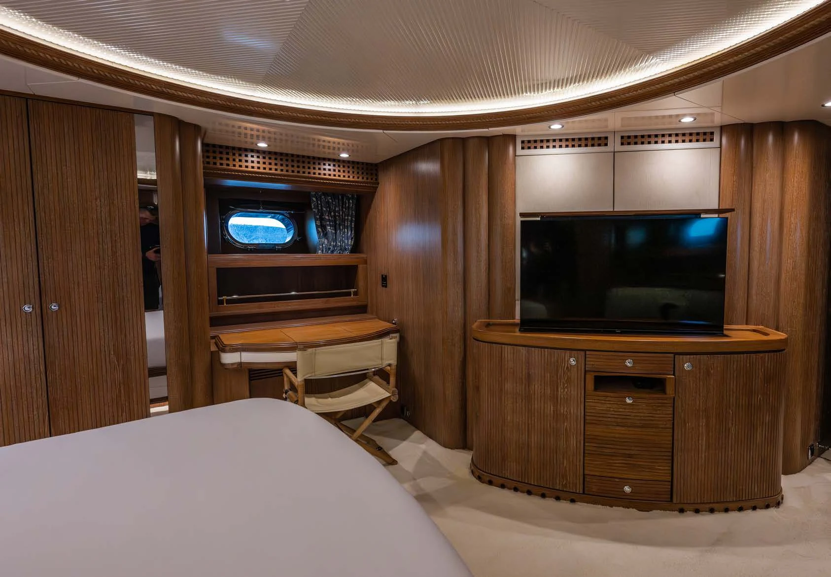 a hotel room with a tv and bed aboard LA CATTIVA 1 Yacht for Sale