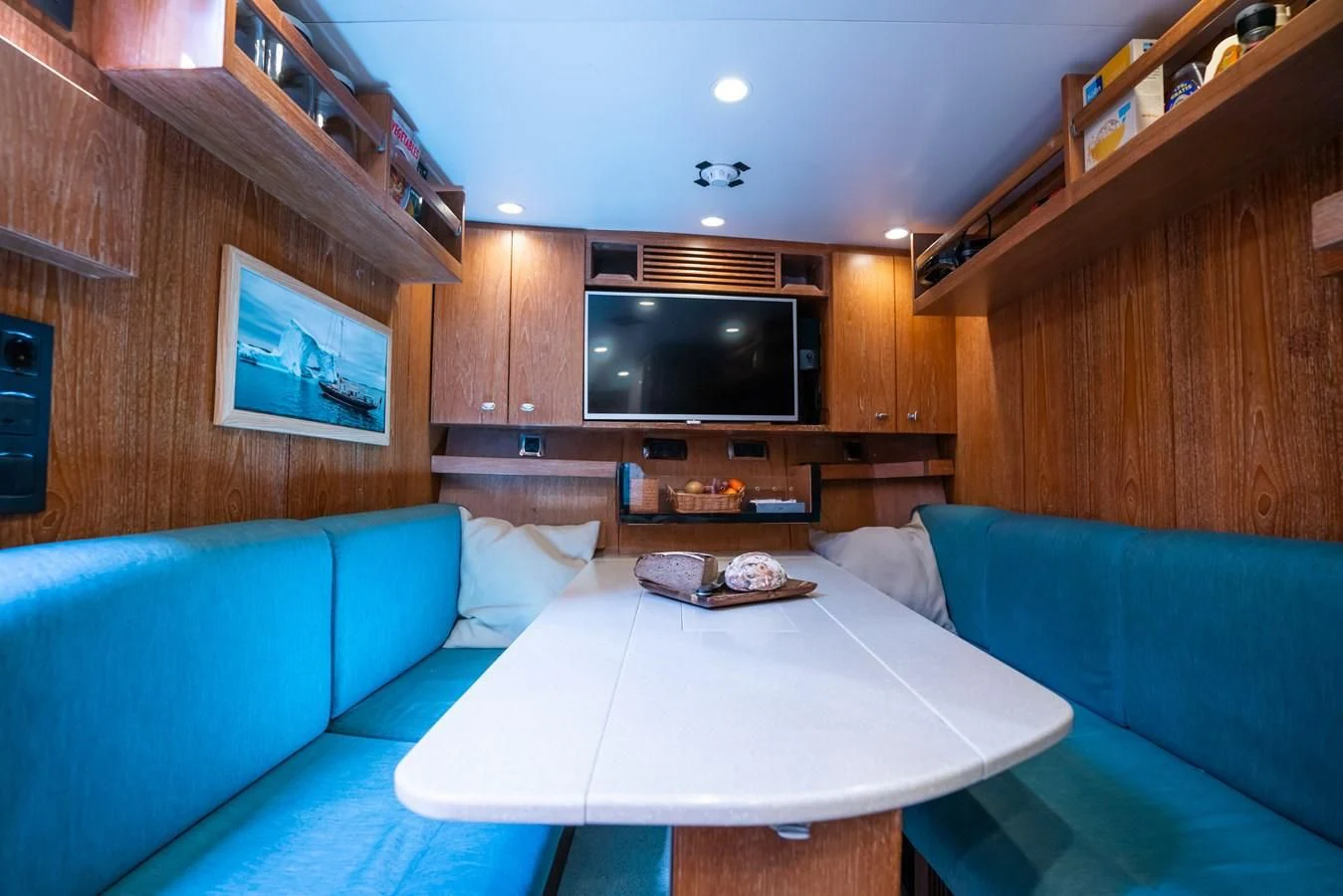 a living room with a couch and a television aboard LA CATTIVA 1 Yacht for Sale