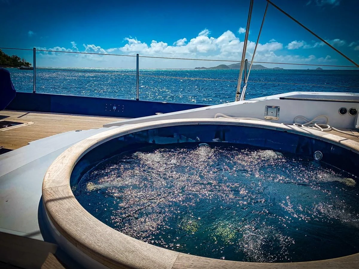 a large white boat on a body of water aboard LA CATTIVA 1 Yacht for Sale