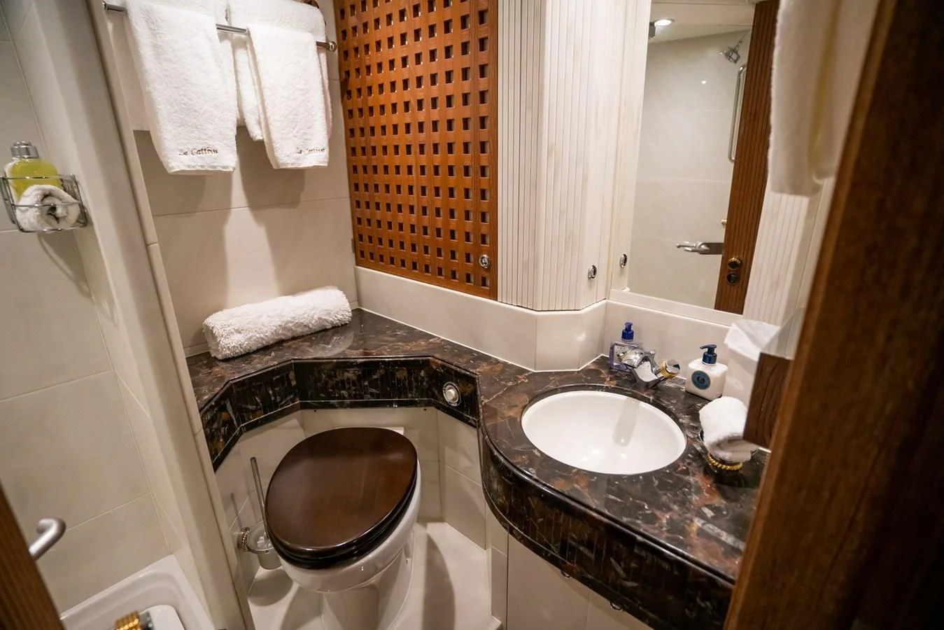 a bathroom with a sink and a tub aboard LA CATTIVA 1 Yacht for Sale
