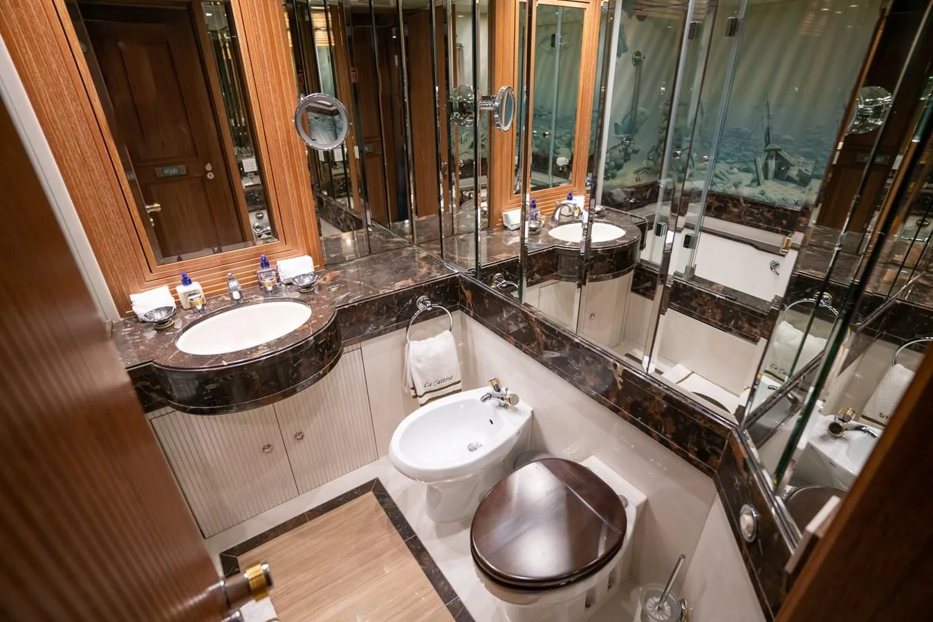 a bathroom with sinks and mirrors aboard LA CATTIVA 1 Yacht for Sale