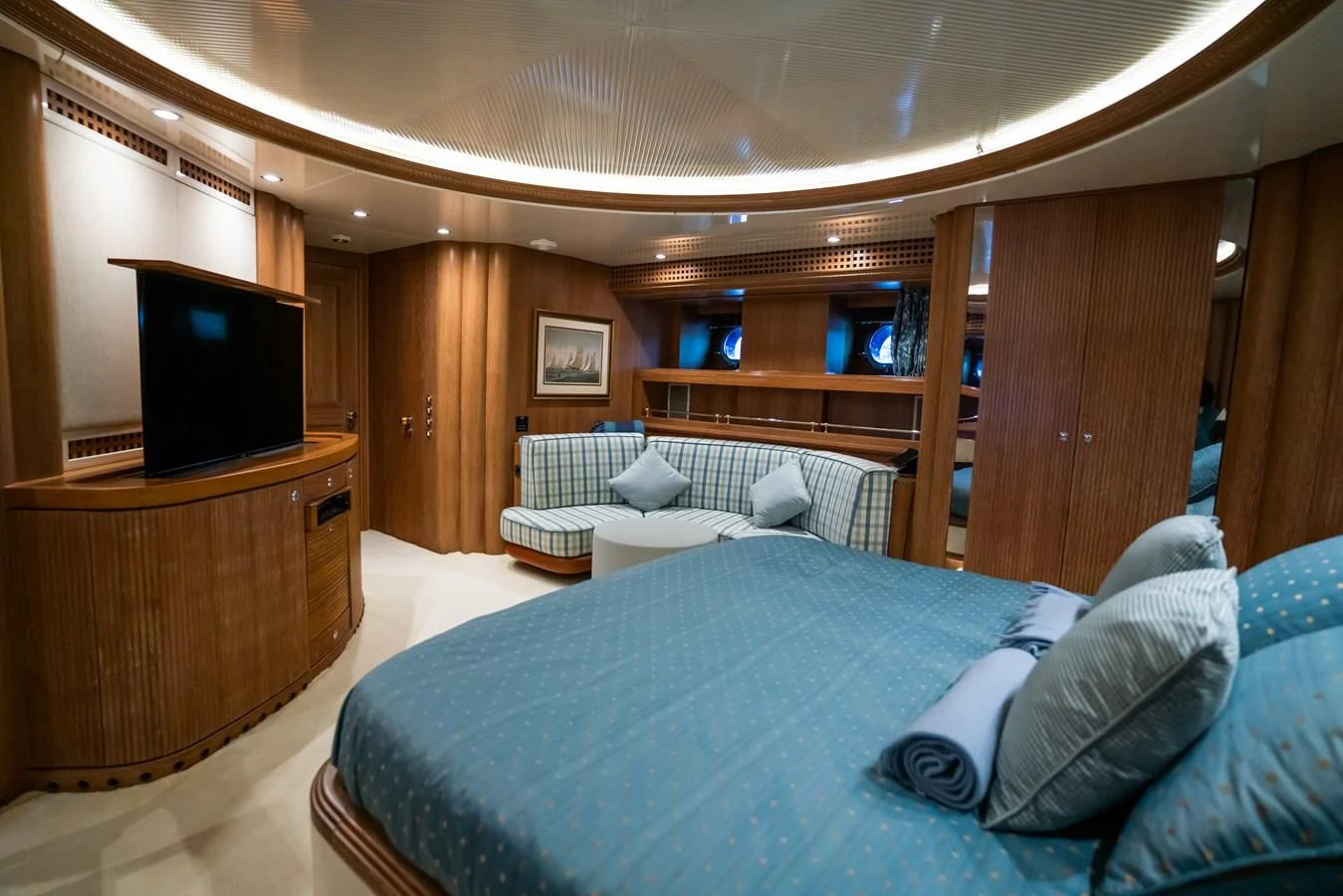 a room with a bed and a television aboard LA CATTIVA 1 Yacht for Sale