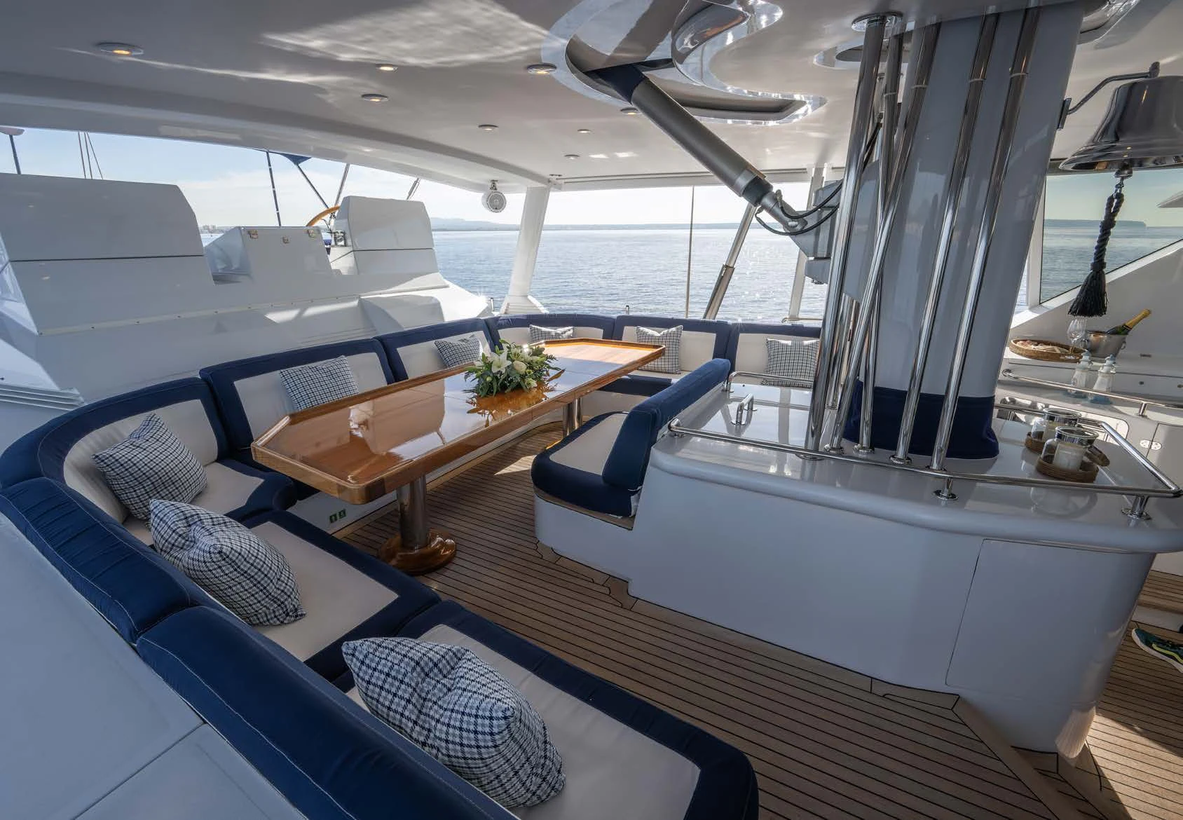 a large yacht with a table and chairs aboard LA CATTIVA 1 Yacht for Sale