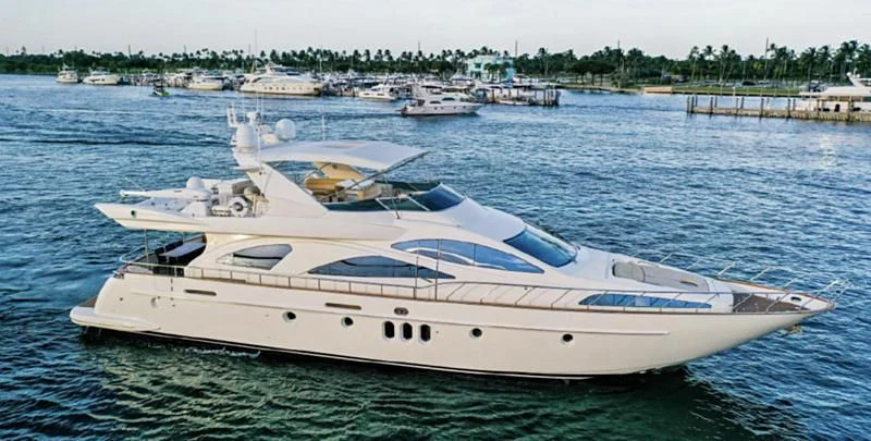 a white yacht in the water aboard DELMAR Yacht for Sale