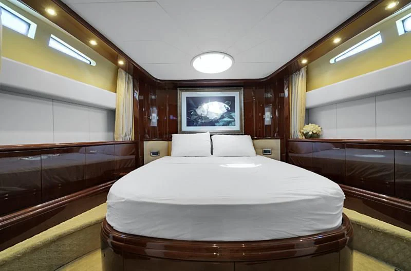 a large bed in a room aboard DELMAR Yacht for Sale