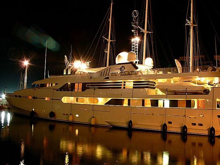 a boat with lights on the water aboard IL VAGABONDO Yacht for Sale
