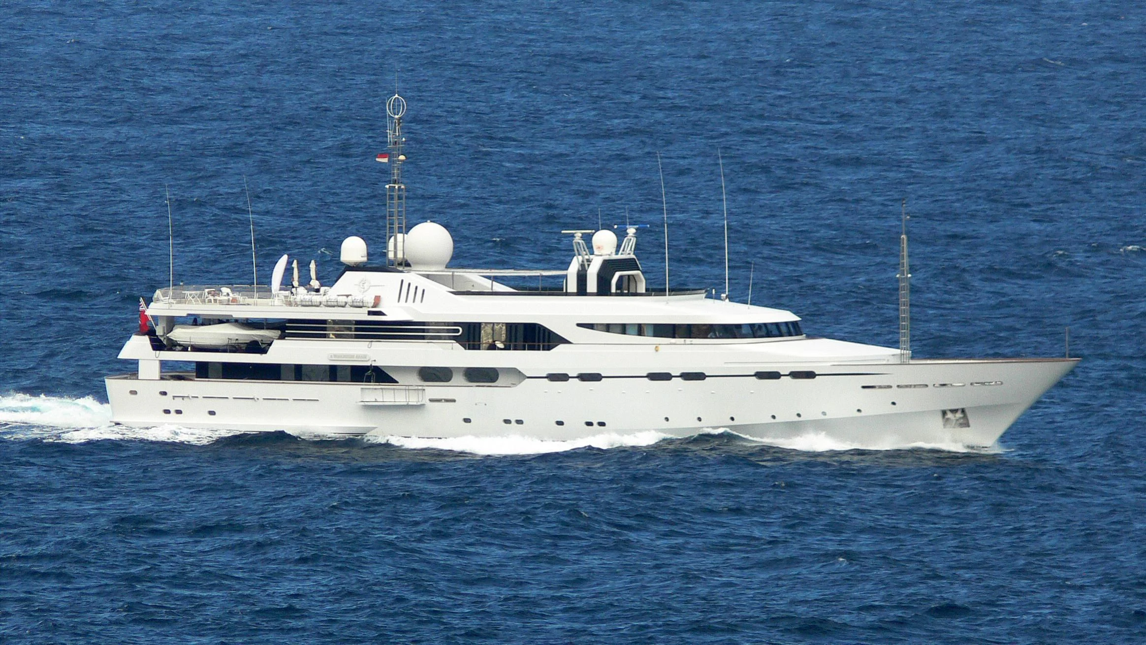 a white yacht in the water aboard IL VAGABONDO Yacht for Sale