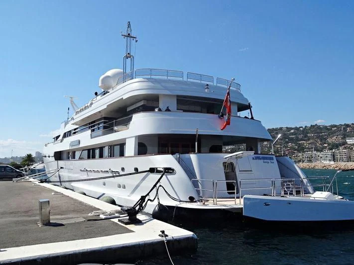 a large white boat docked aboard IL VAGABONDO Yacht for Sale