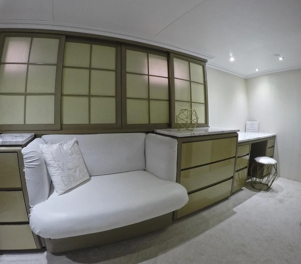 a room with a couch and a desk aboard ISABELLA Yacht for Sale