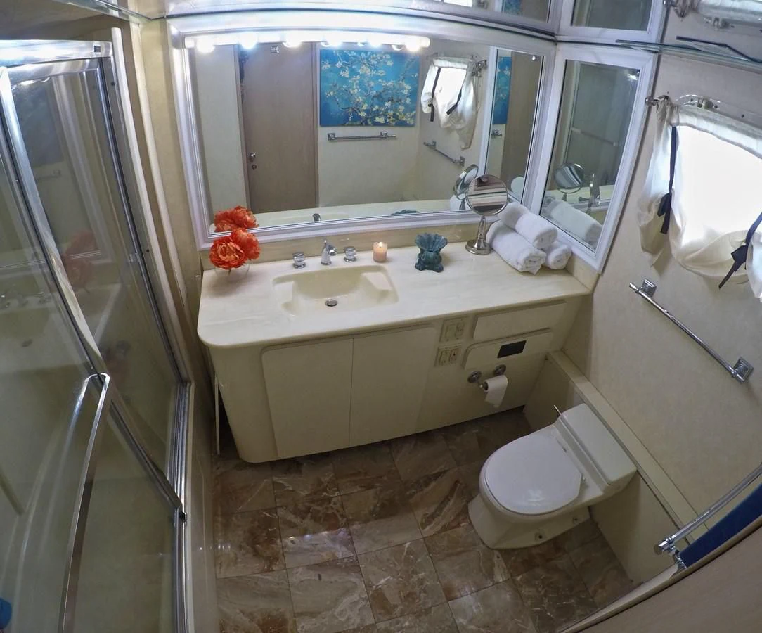 a bathroom with a sink toilet and bathtub aboard ISABELLA Yacht for Sale