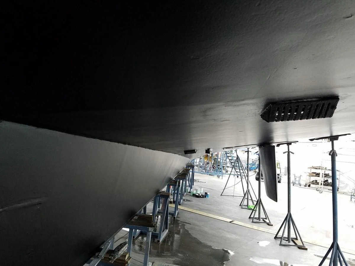 a large room with a large white wall and a black ceiling aboard ISABELLA Yacht for Sale