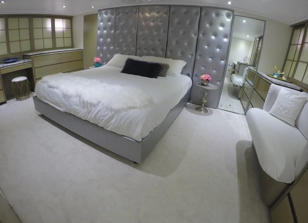 a room with a bed and a chair aboard ISABELLA Yacht for Sale
