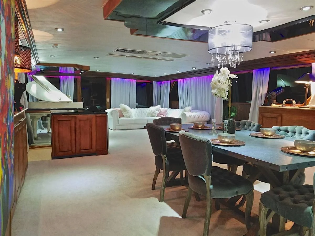 a dining room with a table and chairs aboard ISABELLA Yacht for Sale