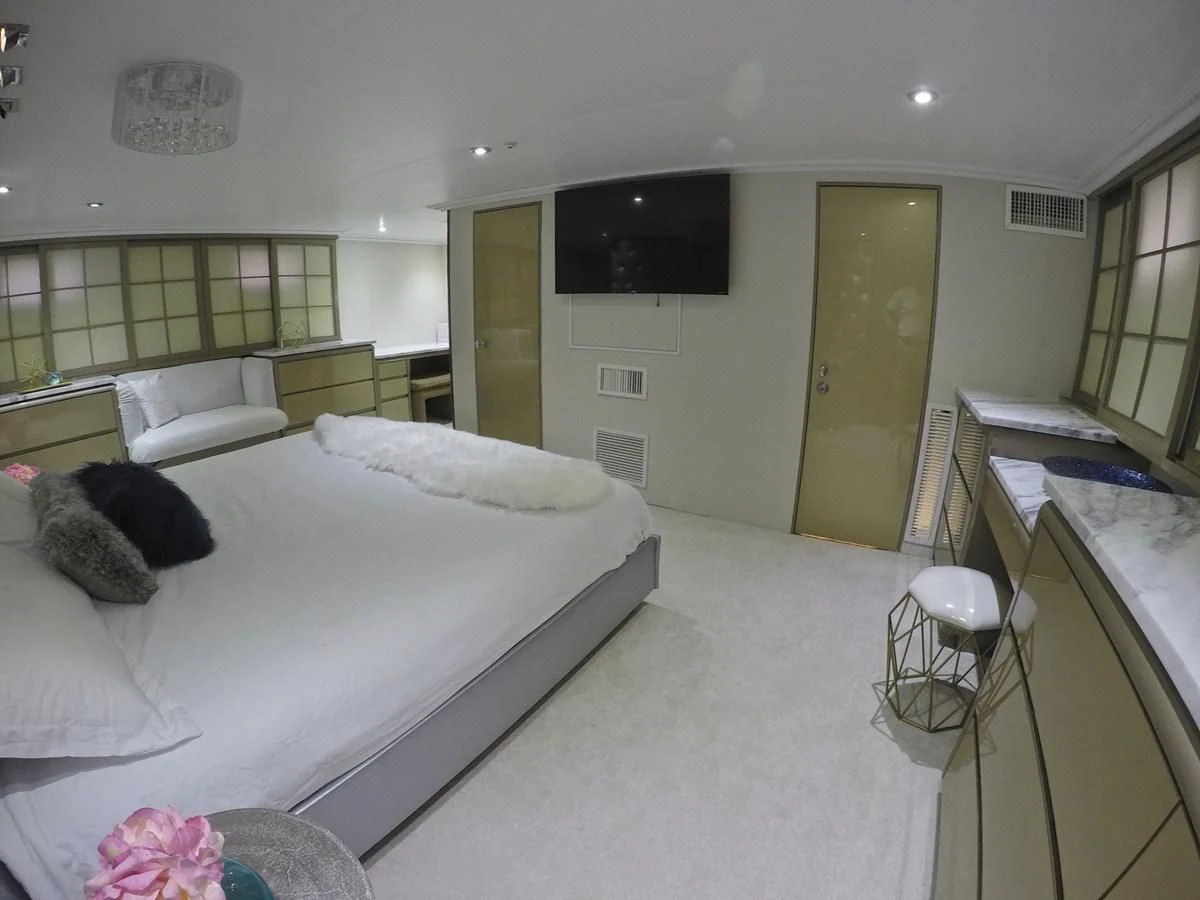 a room with a bed and a tv aboard ISABELLA Yacht for Sale