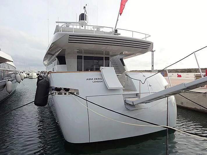 a white boat in a harbor aboard A6M ZERO Yacht for Sale